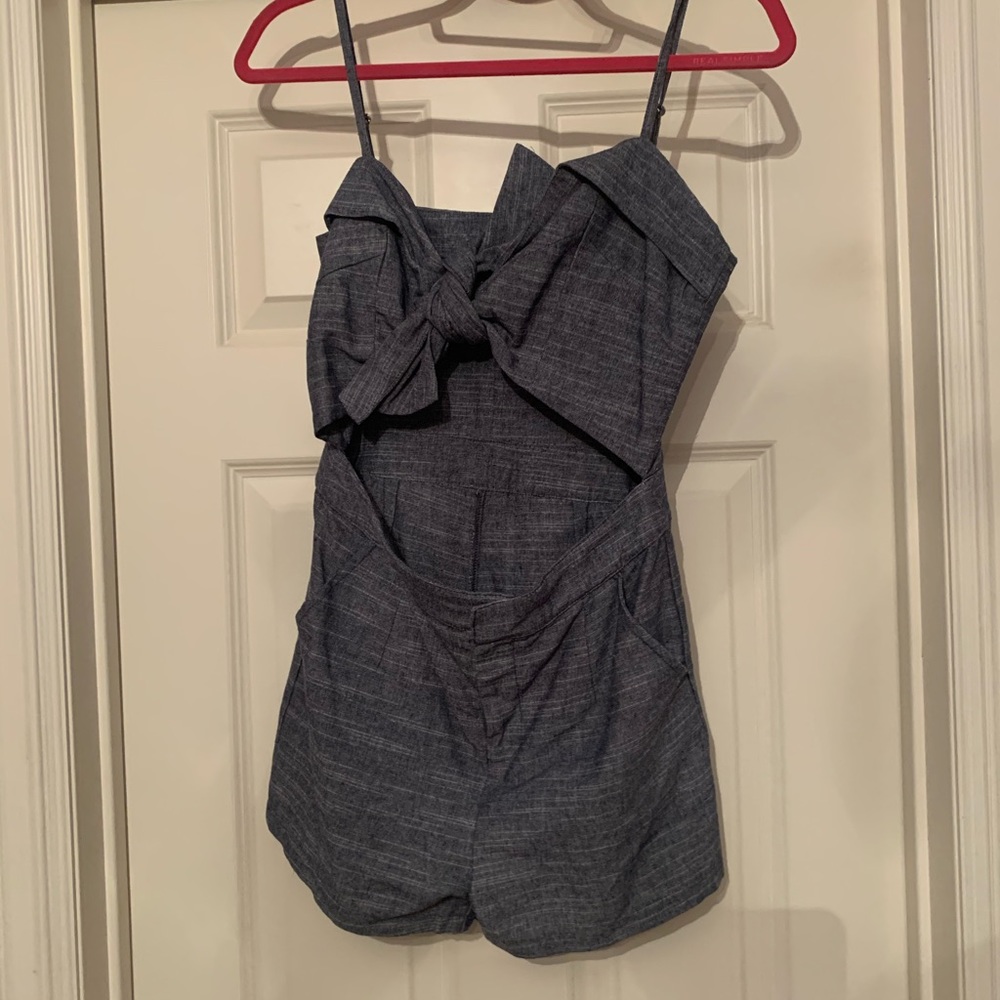 Denim romper with bow front and cut out